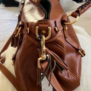 Beautiful tan in pristine condition. Dooney and Bork medium size satchel,